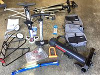 Overall view of the lot showing Yakima bike rack, Vincita panniers, Roces stand, Follow Me bike attachment, Schwinn pumps, locks and accessories.