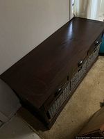 Top view showing dark stained wood surface with visible scratches and wear marks on the bench.