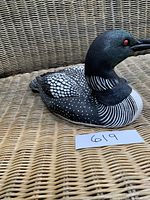Close side view of adult loon decoy showing detailed paint and body