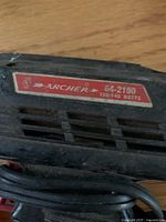 Close-up photo of the Archer 64-2190 soldering gun showing the brand and model tag.