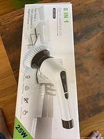 Box showing 8 in 1 Electric Cleaning Brush with 25W power on packaging