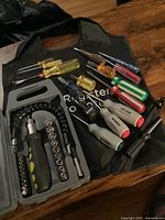 Overall view of flexible socket wrench set with manual screwdrivers on table