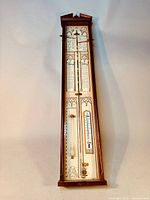 Full view of the 1950's replica Admiral Fitzroy barometer in wood and glass case, showing overall condition and design.