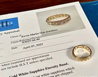 Ring placed atop the appraisal cover sheet showing client reference and ring image