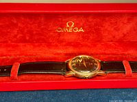 Red Omega presentation box interior with watch laid flat