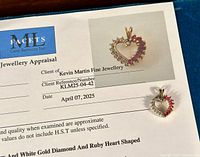 Pendant displayed on appraisal certificate next to a catalog image