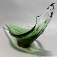 Side view of green and clear Murano Seguso art glass bowl shaped like a gondola
