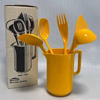Photo of original box with graphic illustration of the yellow melamine serving utensils and pitcher by Accent Montreal Quebec