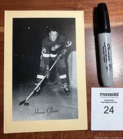 Front of vintage Beehive hockey photo showing Howie Glover in Detroit uniform next to a Sharpie marker for size comparison.