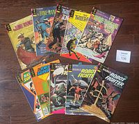 Lot of 10 Gold Key comic books including The Lone Ranger, Twilight Zone, Spine Tingling Tales, and Magnus Robot Fighter laid out on floor showing front covers.