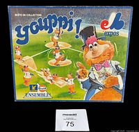 Complete box set with colorful graphic box cover depicting Youppi! and the Montreal Expos logo, showing the figurine poses on a baseball field illustration.