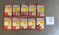 Lot of 10 unopened 1991 Soccer Shots soccer card wax packs laid out on a flat surface showing front of each package