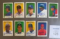 Lot of 9 1995 Old Judge Signature Rookies baseball cards each signed in blue Sharpie, showing front portraits and autographs.