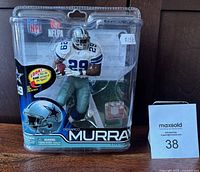 Front view of sealed Demarco Murray NFL figurine in Dallas Cowboys uniform inside original packaging with price sticker $159