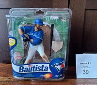 Front view of sealed 2012 Jose Bautista figurine in original packaging with Blue Jays branding.