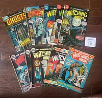 Photo showing full lot of 10 DC Comics comic books including "Ghosts" and "It's Midnight The Witching Hour" series arranged on floor.
