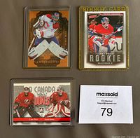 Front view of three Carey Price hockey cards including Upper Deck Artifacts, Victory Rookie, and In The Game Duals.