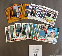 Lot of 49 Montreal Expos baseball cards spread out, showing various players and card designs.