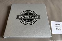 Closed silver collector's album with NHL and Canada Post branding (2015 Series 3)