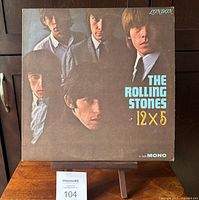 Front cover of The Rolling Stones 12 x 5 album showing band members and title text.