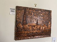 Front view of copper relief showing village of Ulm with buildings, towers, and bridge detail.