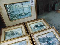 Framed landscape paintings with visible water marks and wear on mats and frames. Set of 5 with 1 large and 4 smaller images.