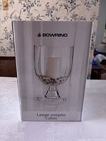 Front photo of Bowring hurricane candle holder in original box, showing product image and brand name.