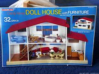 Original packaging box showing the Blue Box Candy Home Doll House with Furniture, 32 piece set with a red roof and interior furniture layout.