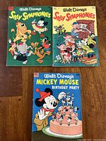 Top three comics: two Silly Symphonies and one Mickey Mouse Birthday Party comic
