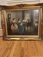 Full frontal image of the gilded gold framed print showing the complete view of the artwork with two women inside a Victorian styled room.