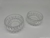 Two clear Gorham lead crystal bowls shown side by side on a plain background, highlighting their cut faceted design and size.