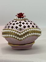 Front and side view of the Italian Rucinni trinket box with pink enamel, pearl trim, and red rose top detail.
