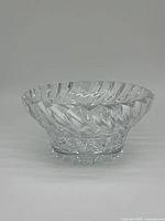 Side profile of the clear Mikasa crystal bowl showing angled cut pattern on the bowl sides and starburst base