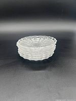 Stack of six clear glass teabag coasters/spoon rests with scalloped edges and ridged decorative surface