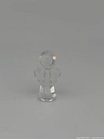 Front view of the Swarovski clear crystal miniature angel figurine showing the round head, faceted wings and body.