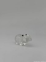 Front view of clear faceted crystal Swarovski hippo figurine showing black eyes, 1 inch size