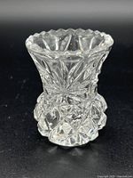 Clear side view of vintage crystal toothpick holder showing intricate cut pattern and scalloped rim