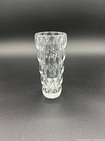 Side view of the vintage Fostoria Glass Company Grace pattern crystal vase showing its textured oval and diamond-shaped cut design and overall shape.