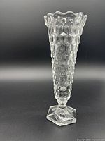 Front view of the clear glass Fostoria Cubit vase showing hexagonal textured pattern, flared top, and hexagonal base.