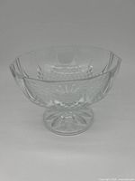 Front angle of the clear crystal footed bowl showing detailed cuts and scalloped rim.