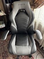 Front view of Emerge leather gaming chair showing upholstery and armrests.