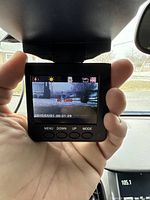 Dash cam LCD screen showing 'NO CARD' message and controls