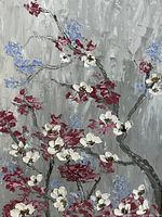 Close-up of acrylic painting with red, white, and blue flowers on gray background.