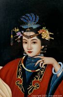 Close-up of portrait showing Oriental woman on black background, painted on glass, features ornate headdress with blue feathers and floral elements