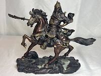 Front view showing Guan Yu mounted on horse wielding polearm