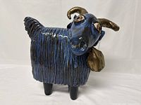 Front three-quarter view showing face, body texture and crystal earring on right ear