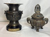Both Chinese bronze items positioned side by side against white background, showing relative size and details