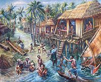 Full view of framed oil painting showing tropical village scene with many figures and thatched huts