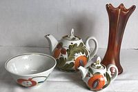 Koransha Arita porcelain bowl and two Ukrainian floral teapots alongside the Marigold Carnival Glass vase