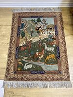 Full view of entire rug showing pictorial design and fringe